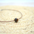 collar-esfera-ceramica-artesania-plata-cuero-marron